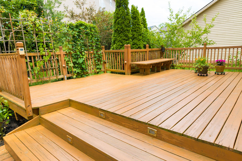 Brand new deck in Kenosha. Leads directly into the greenery of their backyard.